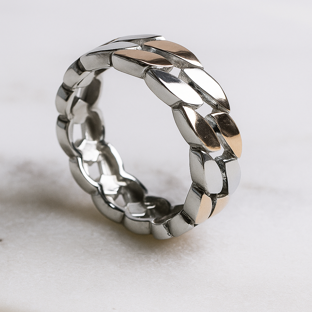 Silver ring with a textured design on a light background