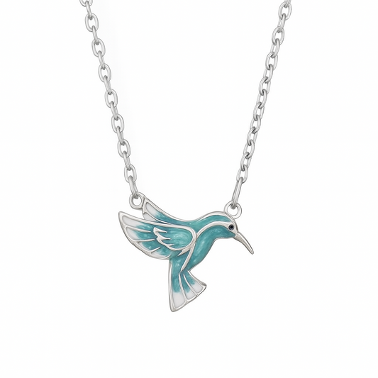 Silver necklace with a turquoise hummingbird pendant on a white background